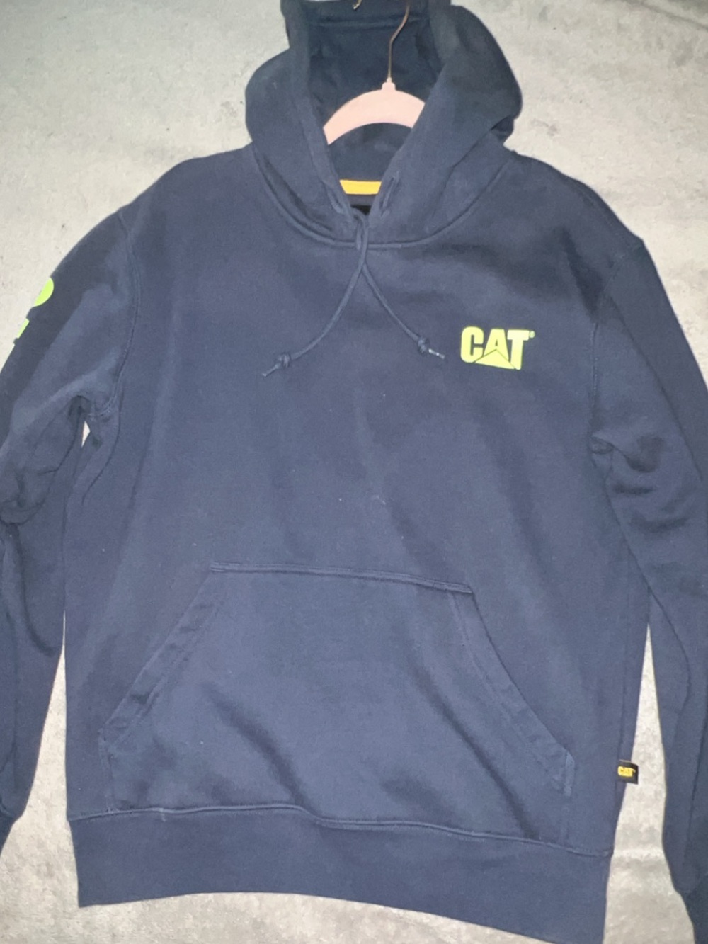 Caterpillar Navy Pullover Hoodie with Neon Yellow Logo on Chest and Sleeve